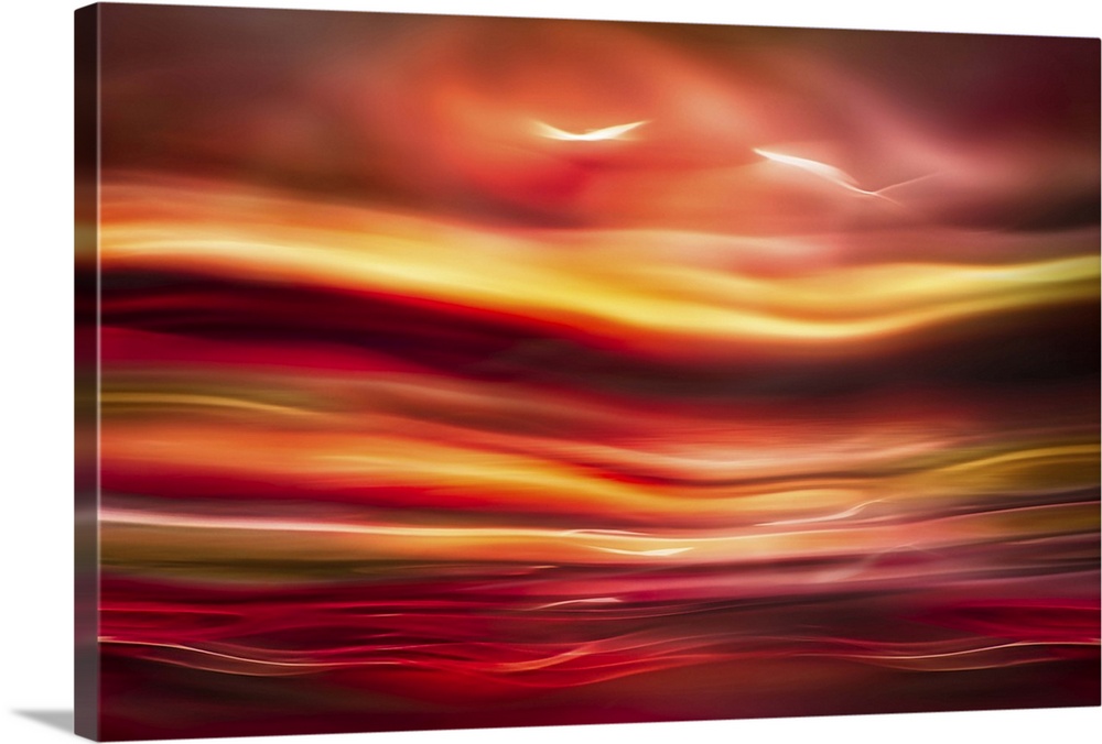 An abstract photograph of vibrant colors in a wave-like formation.