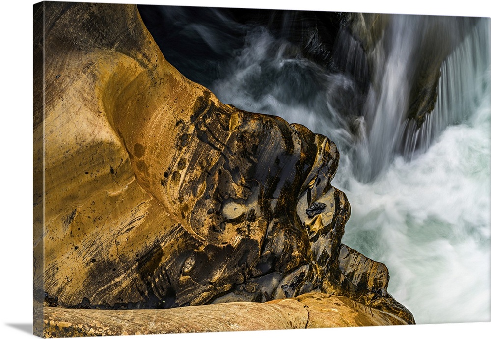 Closeup of water and rocks by Numa Falls, in Kootenay National Park, Canada.