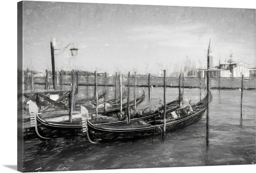 Fine art photo of gondolas at a dock in Venice, Italy, in black and white.