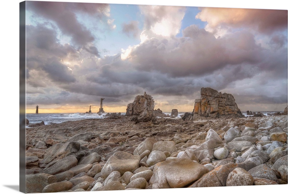 Colored sunset at Pointe de Pern place in Ouessant island in France among rocks.