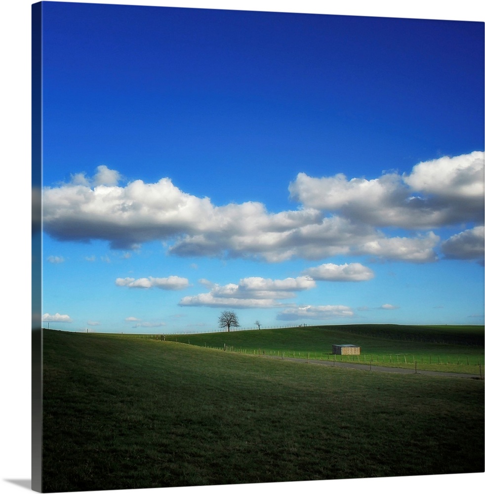 Countryside landscape with blue sky and clouds
