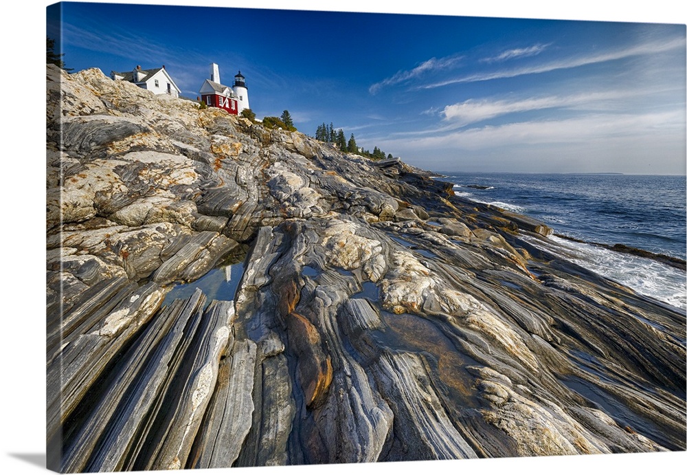 Low Angle View of a Rocky Shoreline with a Lighthouse, Pemaquid Point, Maine.
