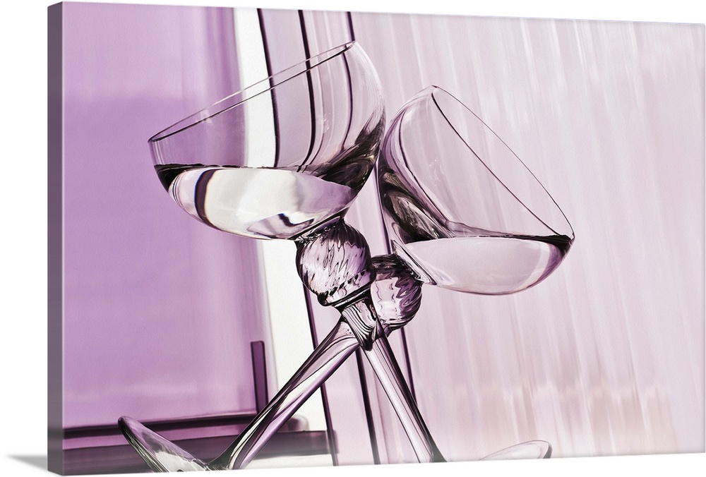 A photograph of two leaning wine glasses forming an X against an abstract purple background.