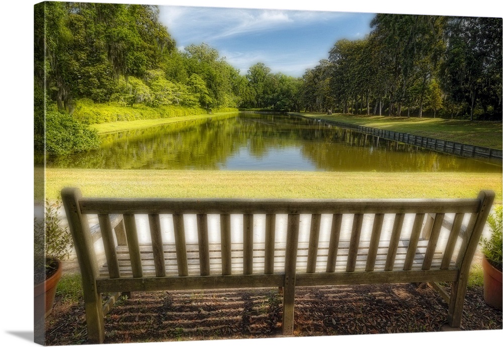 A photograph of a bench looking out to a pond in South Carolina.
