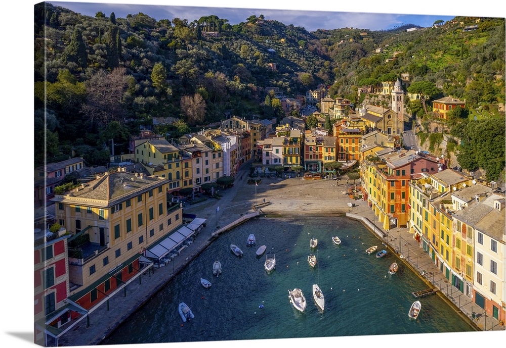 Portofino is a fishing village on the Ligurian Riviera near the city of Genoa. Pastel-colored houses overlook the Piazzett...