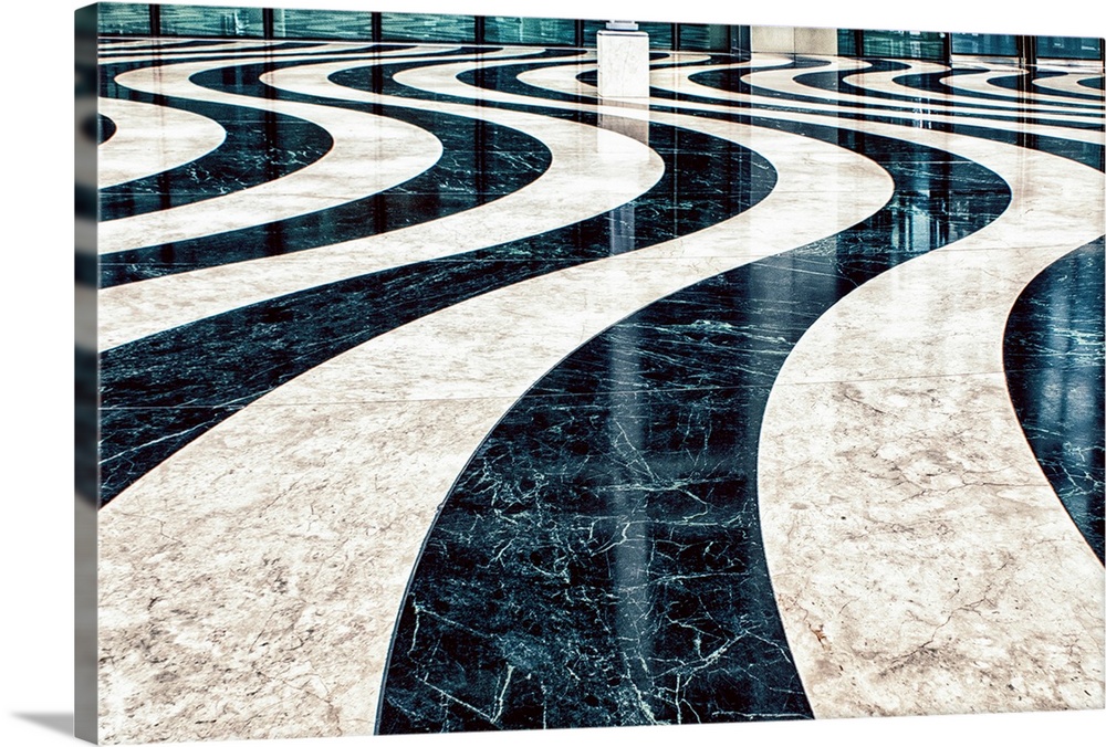 Fine art photo of a polished floor in a wavy black and white pattern.
