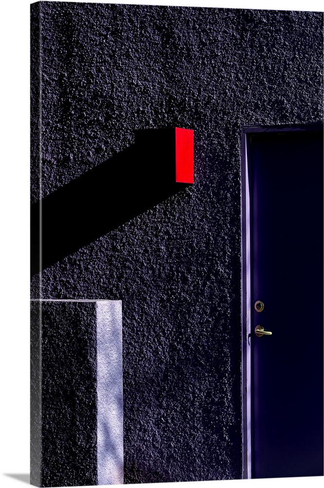 A red sign sticking out from the side of a purple wall, casting a long shadow.