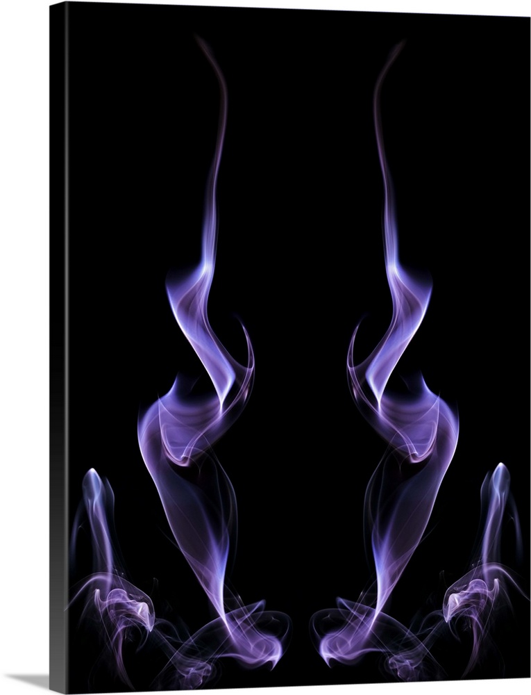 Abstract symmetrical image of purple colored smoke, resembling fire.