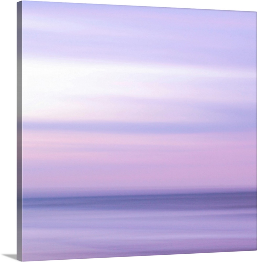 Abstract artwork of a sunset sky over the ocean with a haze over the entire piece to give it a softer look.