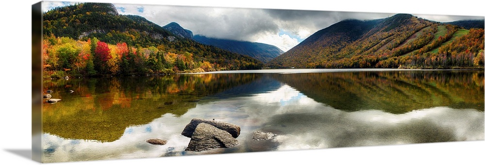Fine art photo of mountains reflected in a lake in New Hampshire in autumn.