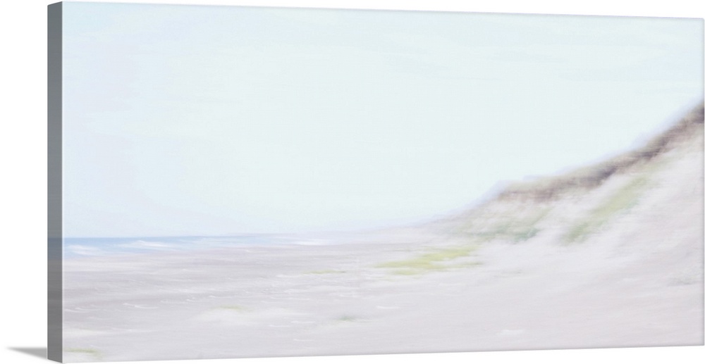Artistically blurred photo. Waves come to rest on the beach in the safe embrace of the dunes.