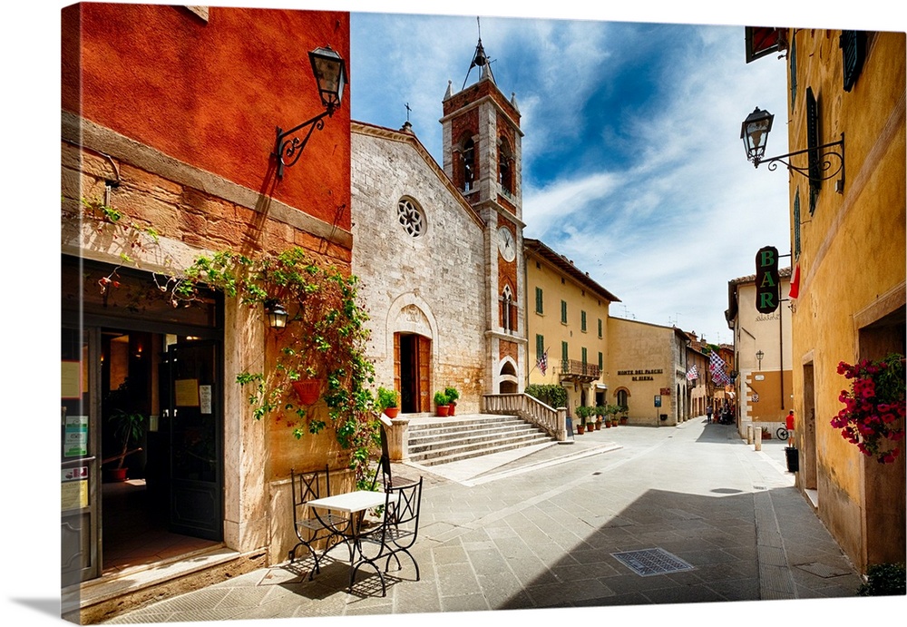 Street with a Catholic Church, San Quirico, Tuscany, Italy.