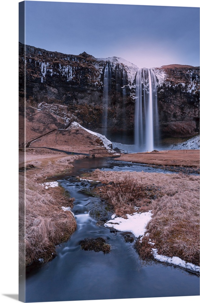 Long exposure of Seljalandsfoss Falls, one of Iceland's most famous waterfalls where you can walk behind.