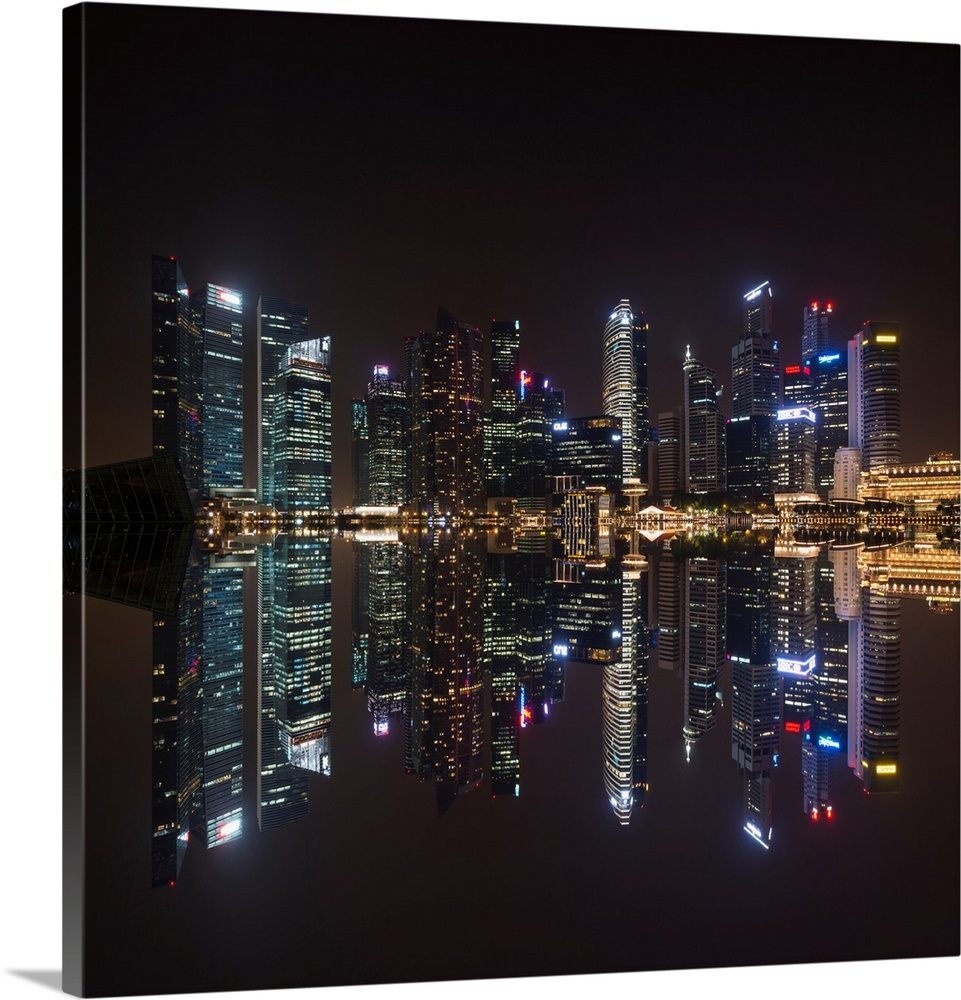 Fine art photograph of the Singapore skyline reflected in the bay at night.