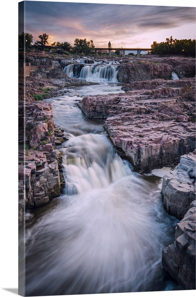 Cascading waterfall in Sioux Falls South Dakota during sunset.