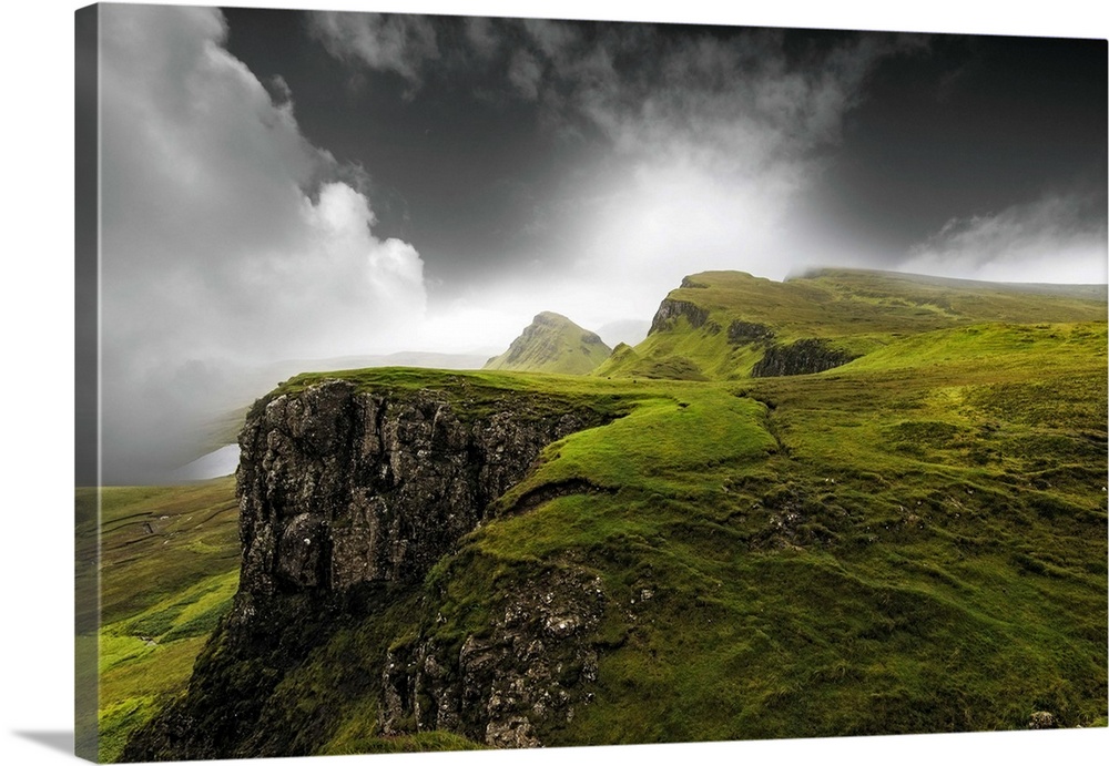 Fine art photo of a misty valley with rocky cliffs.