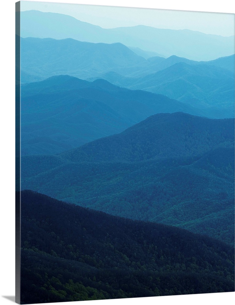 Hazy blue light over the rolling ridges of the Great Smoky Mountains.