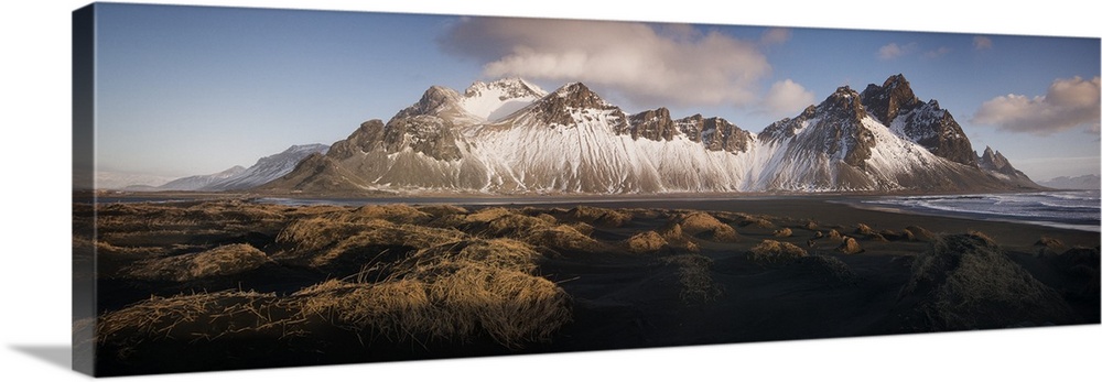 Panoramic view of Vestrahorn mountain covered in snow, seen from the black sand beach, Stokksnes, Iceland.