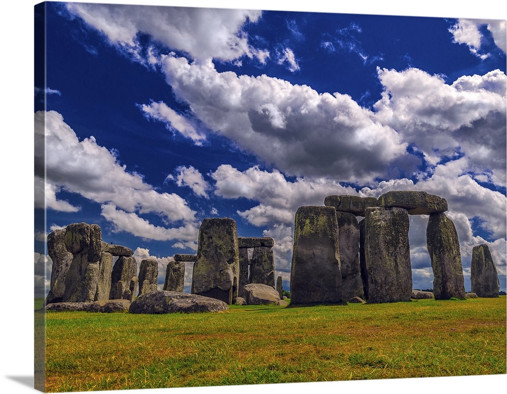 England's Stonehenge site rests under magnificent billowing clouds and deep blue skies.