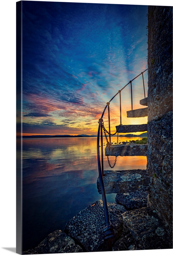 Sunset over an Irish lake with stairs in the foreground
