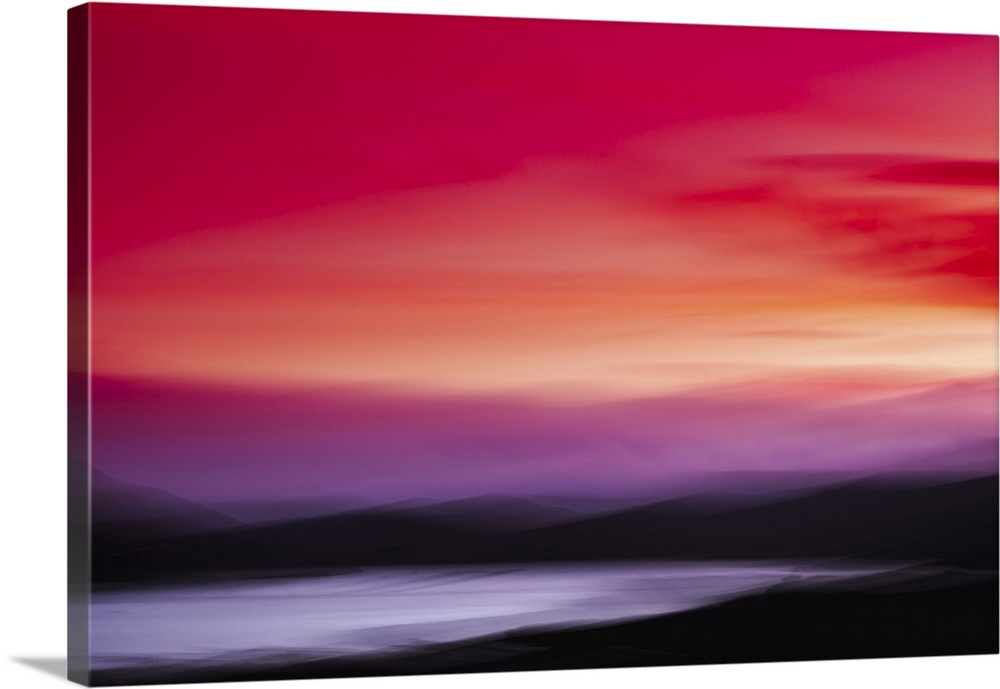 Abstract landscape sunset with red and pink skies over black mountains and a lake.