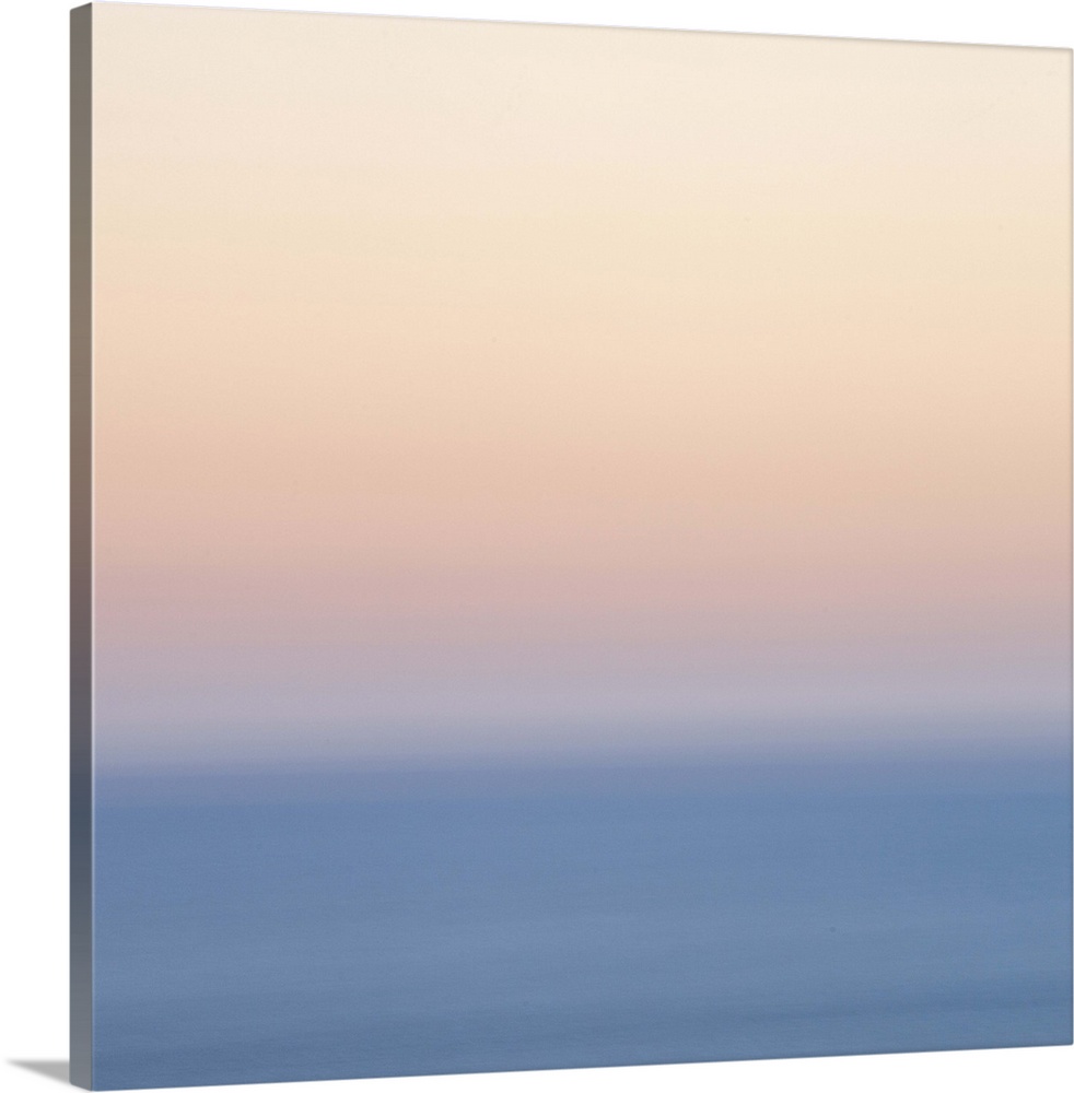 A soft dreamy blurred natural abstract in layers of gentle pastel peach, blue and silvery white laers of colour.