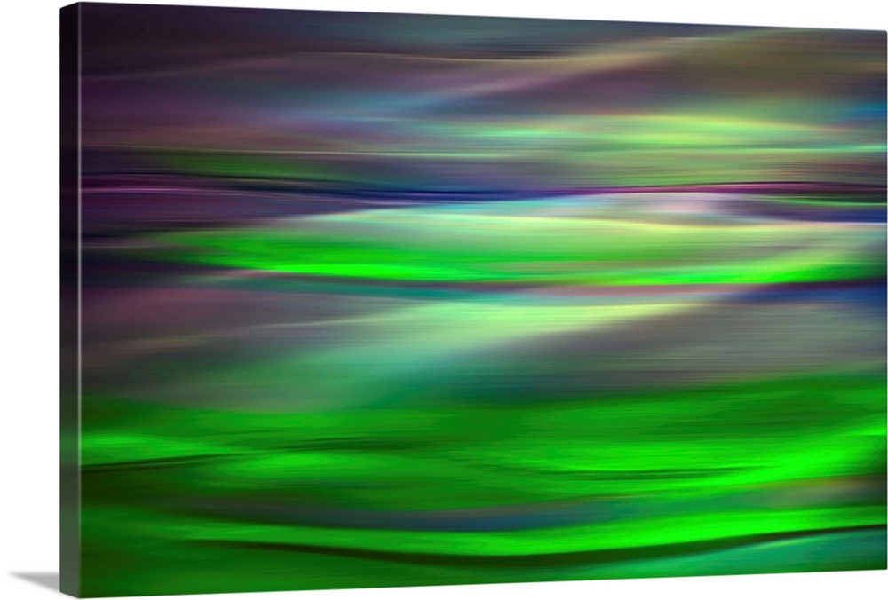 Abstract photograph of a motion blurred landscape of vibrant colors.