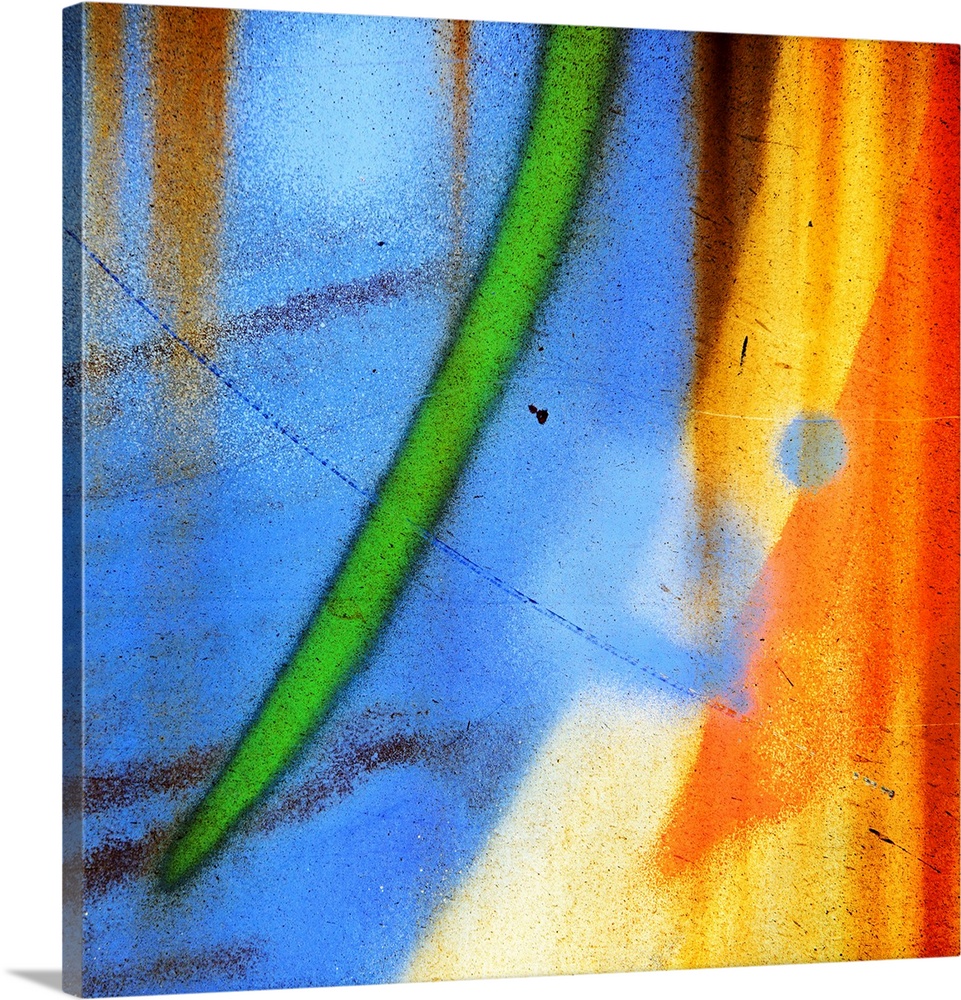 Abstract artwork created from a close up shot of graffiti on a wall, with curved streaks of blue, green, and orange.