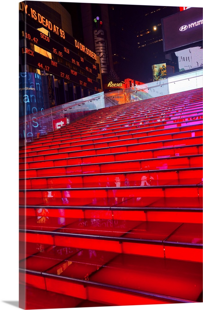 Illuminated red steps outside of Times Square at night, New York City.
