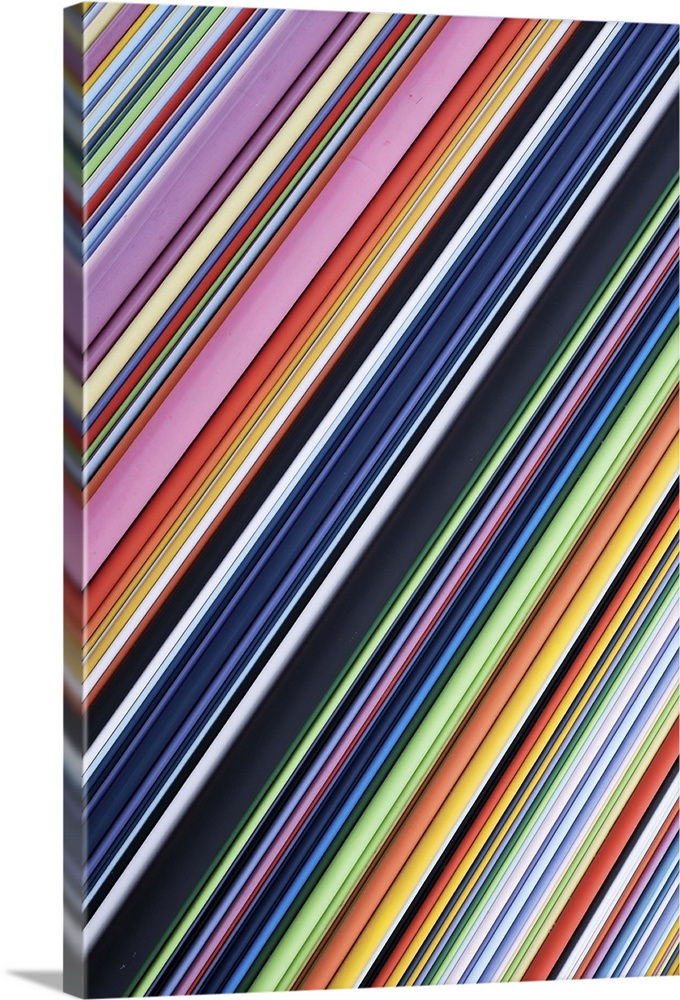 A contemporary energetic rainbow hued abstract with diagonal lines of many shades of colour.