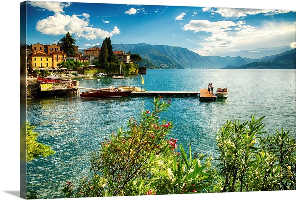 Fine art photo of a pier leading out to the center of a lake in Italy.