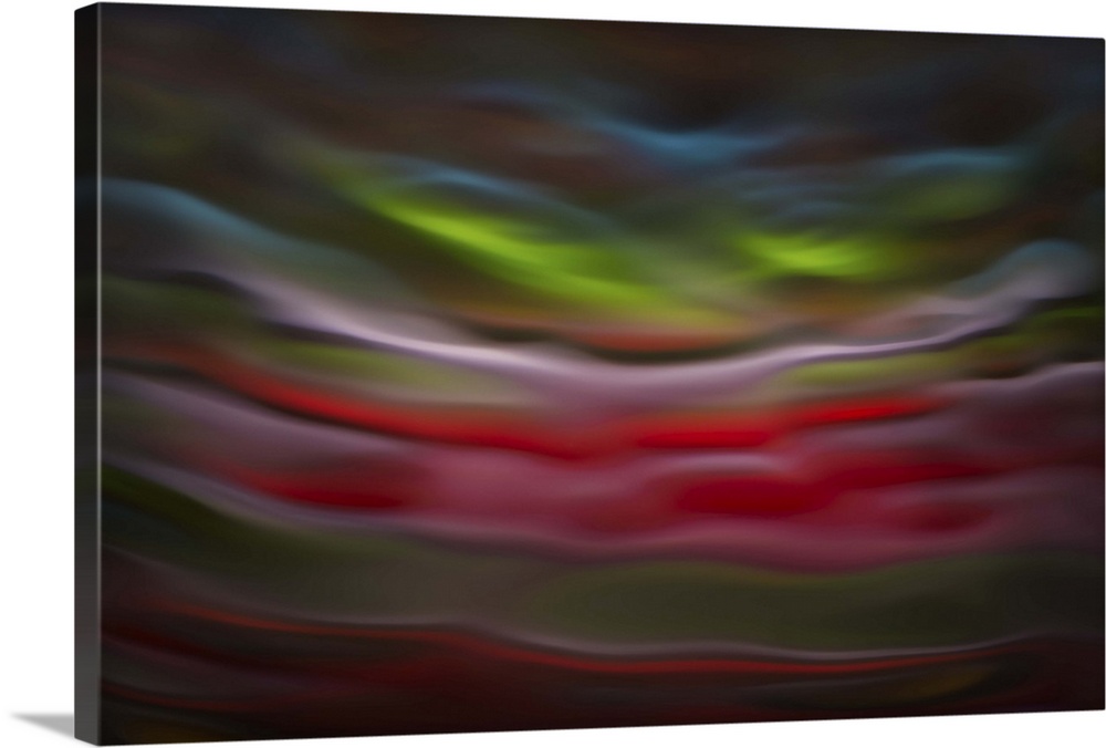 Abstract photograph in green and red shades resembling ocean waves.