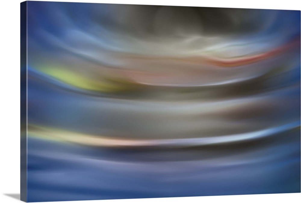 Abstract photograph in grey and blue shades resembling ocean waves.