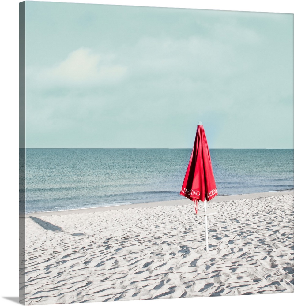 This photo was taken early in the morning on the beach on the Tuscan coast. I like the vintage color with the red of the b...