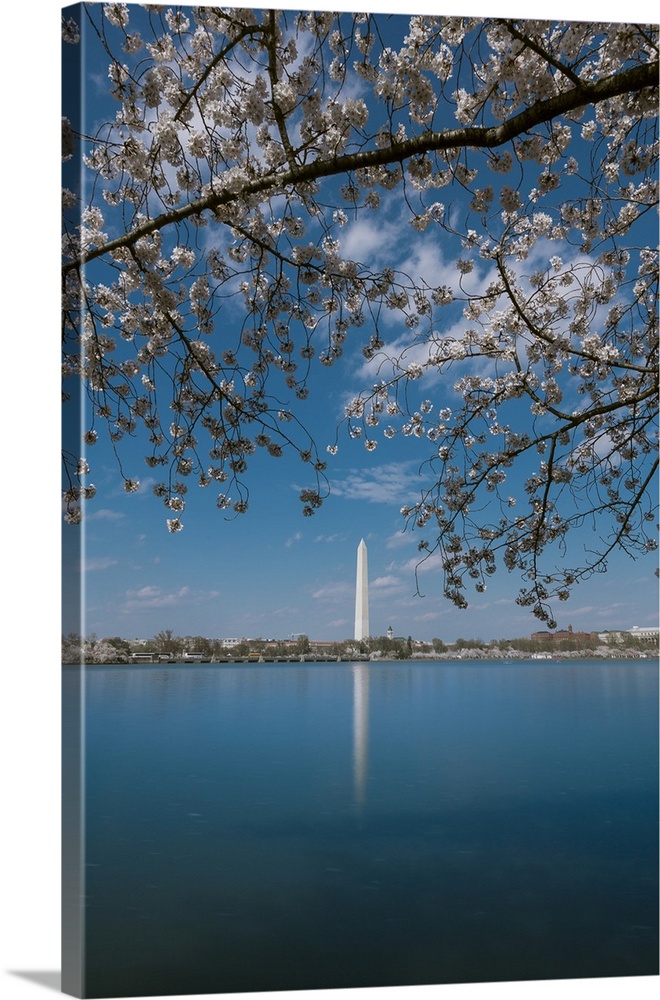 Daytime long exposure of Washington Monument and its reflection in Tidal Basin in the spring