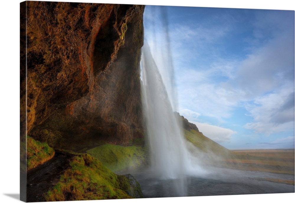 Fine art photograph of a tall waterfall in Iceland.