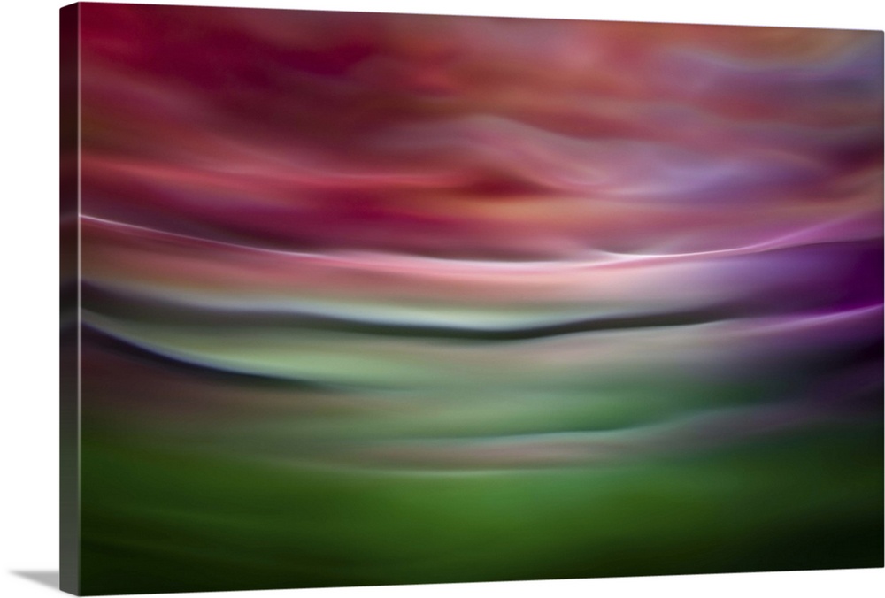 Abstract photograph in green and red shades resembling ocean waves.