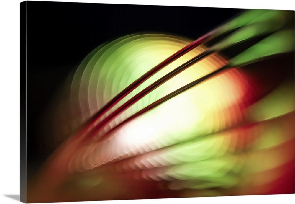 Picture of a plastic whirligig garden decoration, made at extremely close range with a wide aperture Lensbaby. This allows...