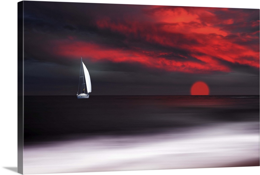White sailboat and red sunset