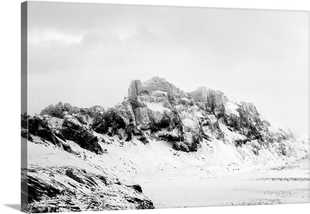 A photograph of a rugged winter landscape.