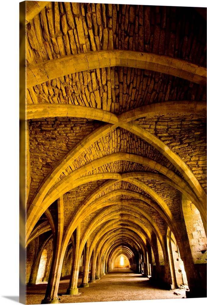 A receeding passage through gothic arches.