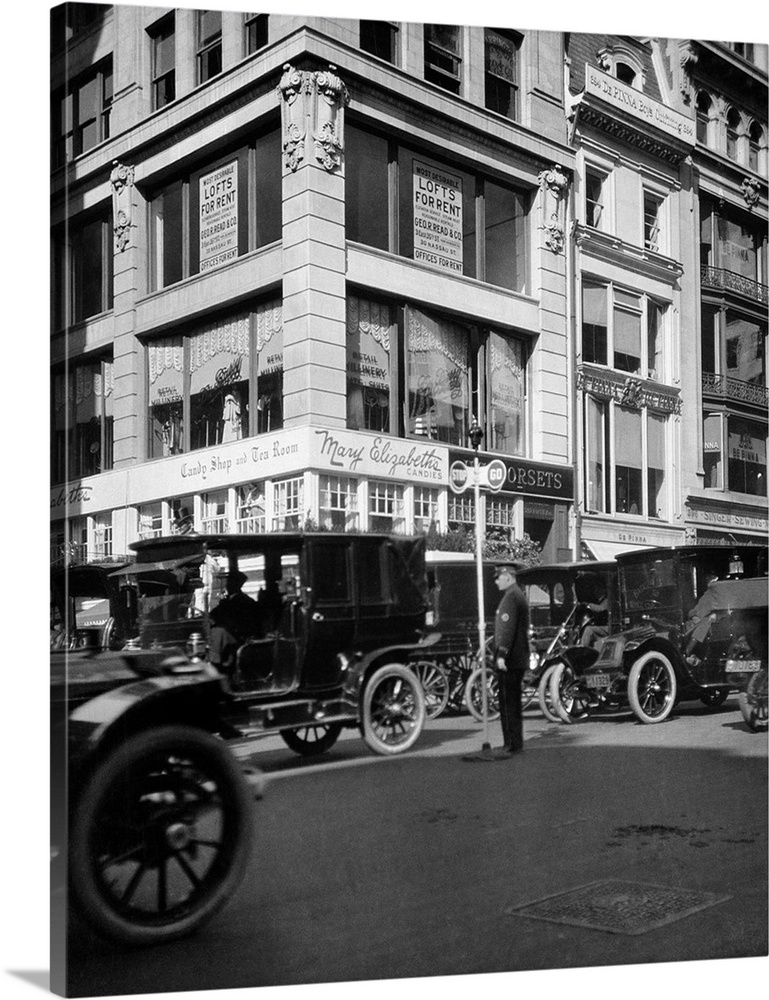 1910's A Policeman Controls Traffic On Fifth Avenue Before Wwi Using A Hand Operated Semaphore Signal New York City USA.