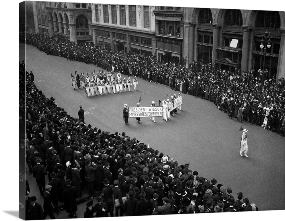 1910's Overhead View Of A Large Crowd Watching People Marching In A Suffrage Parade Circa 1914.