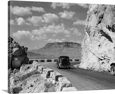1930's 1940's Car Driving On Mountain Road In Yellowstone National Park