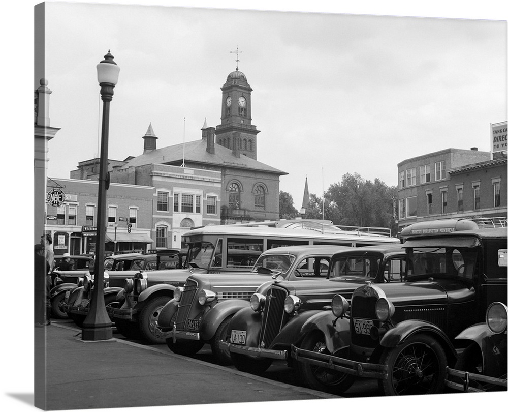 1930's Buses Cars Parked Small Town Square Claremont New Hampshire USA.