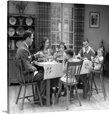 1930's Family Of 6 Sitting At The Table In A Dining Room