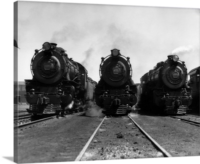 1930's Head-On Shot Of Three Steam Engine Train Locomotives On Tracks