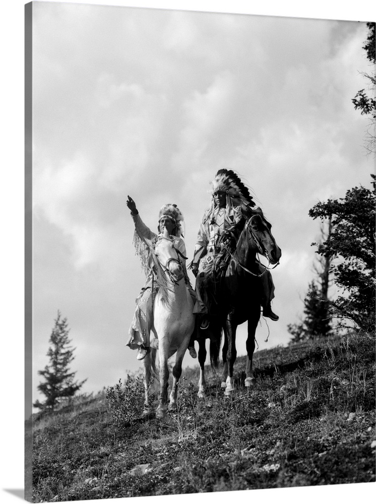 1930s Pair Of Sioux Indians In Headdresses On Horseback Pointing Out Trail.