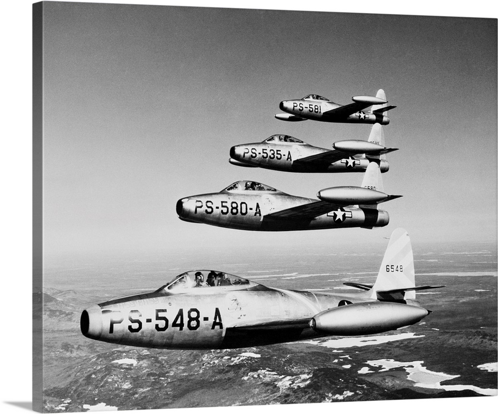 1950s Four Us Air Force F-84 Thunderjet Fighter Bomber Airplanes In Flight Formation.