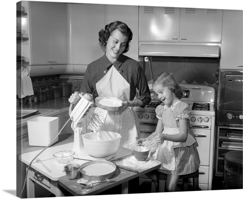 1950s Mother and Daughter Baking A Cake.